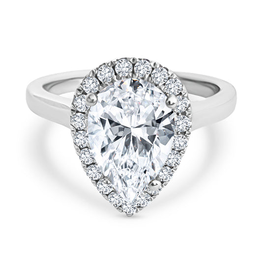 Diamond ring with a pear-shaped center stone on a white background