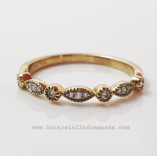 Fine wedding ring or stacker ring.10k yellow and natural diamonds.